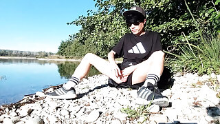 Where will he cum? After working out outside near a lake, this gay Asian twink takes his cock out of his very short shorts and j